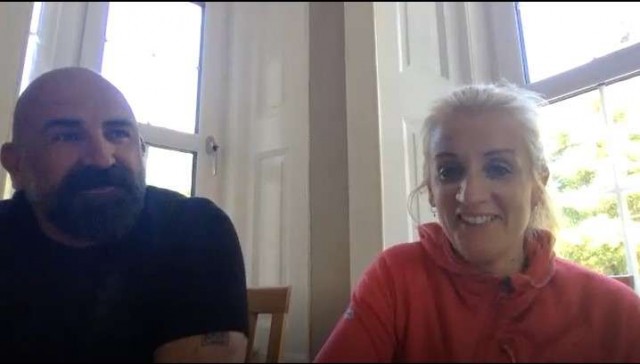 Couple sitting chatting.