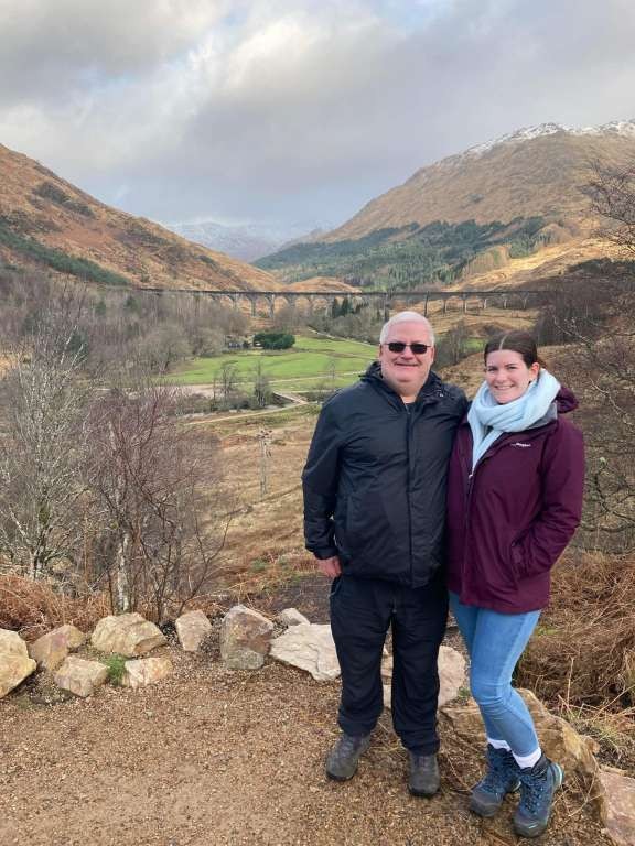 Father and daughter - Sean and Julia McBride - standing in front of the Glenfinnan Viaduct, Fort William, Scotland