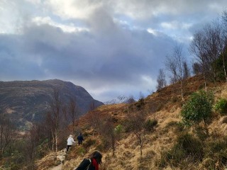 Mountain path with people walking on it