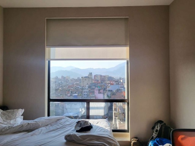 Hotel room with city view.