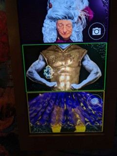 Robin G Coles (author of this story) is trying out different mardi gras costumes at Vue Orleans